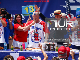 Contestants for the men's title during Nathan's Famous Hot Dogs Eating Contest which takes place annually at Coney Island on Independence Da...