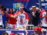 Contestants for the men's title during Nathan's Famous Hot Dogs Eating Contest which takes place annually at Coney Island on Independence Da...