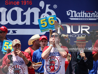 Patrick Bertoletti and other contestants attend the men's title during Nathan's Famous Hot Dogs Eating Contest which takes place annually at...