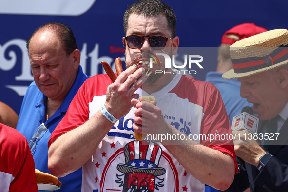 Patrick Bertoletti attends the men's title during Nathan's Famous Hot Dogs Eating Contest which takes place annually at Coney Island on Inde...