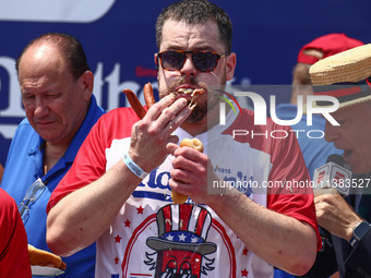 Patrick Bertoletti attends the men's title during Nathan's Famous Hot Dogs Eating Contest which takes place annually at Coney Island on Inde...