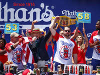 Patrick Bertoletti wins the men's title during Nathan's Famous Hot Dogs Eating Contest which takes place annually at Coney Island on Indepen...