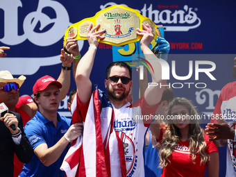 Patrick Bertoletti wins the men's title during Nathan's Famous Hot Dogs Eating Contest which takes place annually at Coney Island on Indepen...