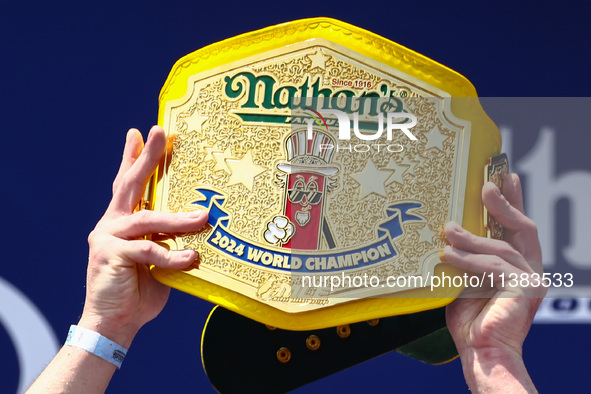 Patrick Bertoletti wins the men's title during Nathan's Famous Hot Dogs Eating Contest which takes place annually at Coney Island on Indepen...