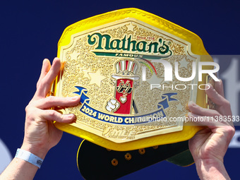 Patrick Bertoletti wins the men's title during Nathan's Famous Hot Dogs Eating Contest which takes place annually at Coney Island on Indepen...