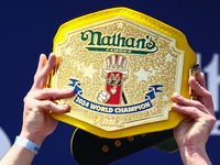 Patrick Bertoletti wins the men's title during Nathan's Famous Hot Dogs Eating Contest which takes place annually at Coney Island on Indepen...