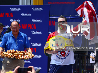 Patrick Bertoletti wins the men's title during Nathan's Famous Hot Dogs Eating Contest which takes place annually at Coney Island on Indepen...