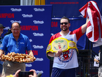 Patrick Bertoletti wins the men's title during Nathan's Famous Hot Dogs Eating Contest which takes place annually at Coney Island on Indepen...