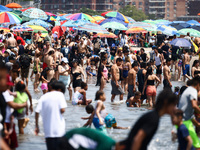 Crowds of people enjoy the beach at Coney Island Beach on Independence Day in New York, United States of America on July 4th, 2024.
 (