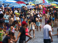 Crowds of people enjoy the beach at Coney Island Beach on Independence Day in New York, United States of America on July 4th, 2024.
 (