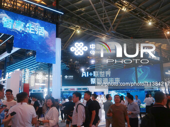 Visitors are visiting the China Unicom exhibition area at the WAIC World Artificial Intelligence Conference in Shanghai, China, on July 4, 2...