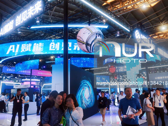 Visitors are visiting the China Mobile exhibition area at the WAIC World Artificial Intelligence Conference in Shanghai, China, on July 4, 2...