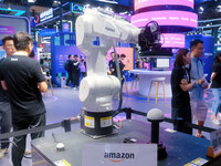 Visitors are viewing a non-human robot at Amazon's booth at the WAIC World Artificial Intelligence Conference in Shanghai, China, on July 4,...