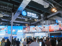 Visitors are visiting the stand of Ant Group at the WAIC World Artificial Intelligence Conference in Shanghai, China, on July 4, 2024. (