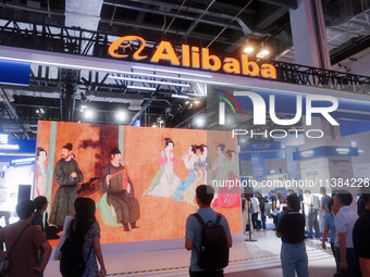 Visitors are visiting the Alibaba exhibition area at the WAIC World Artificial Intelligence Conference in Shanghai, China, on July 4, 2024....