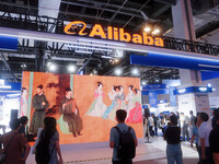 Visitors are visiting the Alibaba exhibition area at the WAIC World Artificial Intelligence Conference in Shanghai, China, on July 4, 2024....