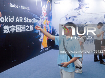 AR and VR games are attracting users to experience them at the WAIC World Artificial Intelligence Conference in Shanghai, China, on July 4,...