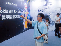 AR and VR games are attracting users to experience them at the WAIC World Artificial Intelligence Conference in Shanghai, China, on July 4,...