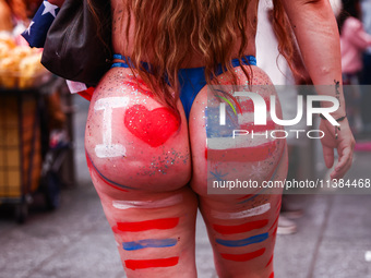 A woman on Times Square on Independence Day In New York, United States on America on July 4th, 2024.
 (