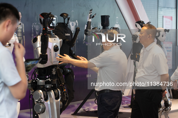 18 Humanoid Robot Vanguard Matrix are being displayed at the entrance of WAIC, World Artificial Intelligence Conference at Shanghai World Ex...