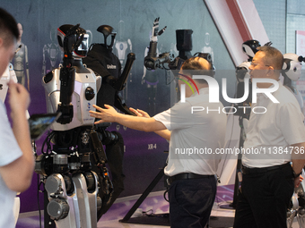 18 Humanoid Robot Vanguard Matrix are being displayed at the entrance of WAIC, World Artificial Intelligence Conference at Shanghai World Ex...