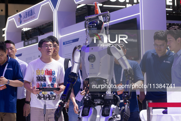 A humanoid robot is performing walking at the World Artificial Intelligence Conference at the Shanghai World Expo Exhibition Center in Shang...