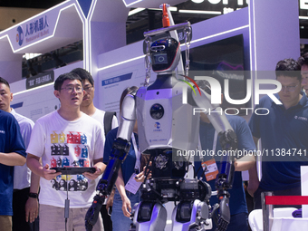 A humanoid robot is performing walking at the World Artificial Intelligence Conference at the Shanghai World Expo Exhibition Center in Shang...