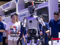 A humanoid robot is performing walking at the World Artificial Intelligence Conference at the Shanghai World Expo Exhibition Center in Shang...