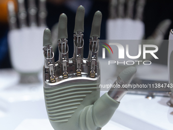 A humanoid robot's hand is being seen at the World Artificial Intelligence Conference at the Shanghai World Expo Exhibition Center in Shangh...