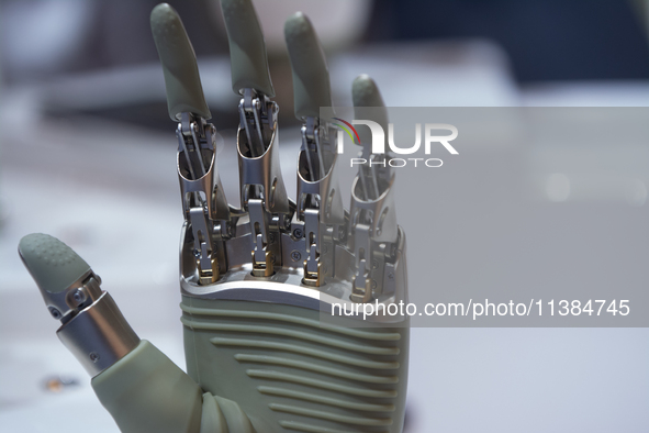 A humanoid robot's hand is being seen at the World Artificial Intelligence Conference at the Shanghai World Expo Exhibition Center in Shangh...