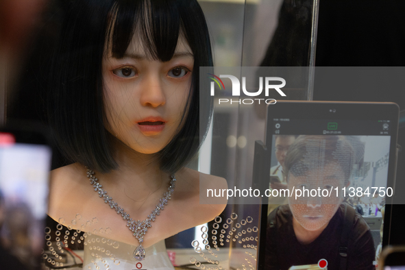 A face mask is synchronizing the facial emotion at the World Artificial Intelligence Conference at the Shanghai World Expo Exhibition Center...