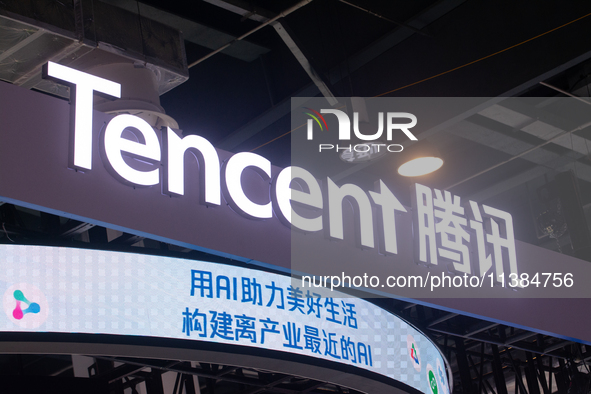 The logo of Tencent is being seen at the Tencent stand at the World Artificial Intelligence Conference at the Shanghai World Expo Exhibition...