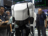 Visitors are taking pictures of the second-generation Optimus Humanoid Robot at the Tesla stand at the World Artificial Intelligence Confere...