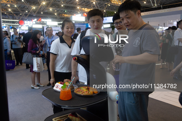 A food ordering robot is being displayed at the World Artificial Intelligence Conference at the Shanghai World Expo Exhibition Center in Sha...