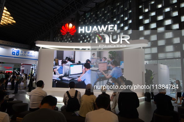 Visitors are visiting the Huawei stand at the World Artificial Intelligence Conference at the Shanghai World Expo Exhibition Center in Shang...