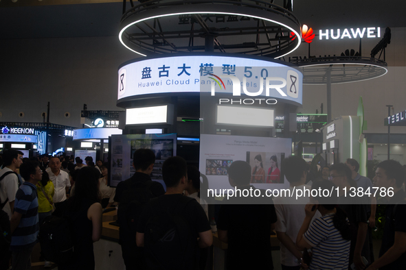 Visitors are visiting the Huawei stand at the World Artificial Intelligence Conference at the Shanghai World Expo Exhibition Center in Shang...