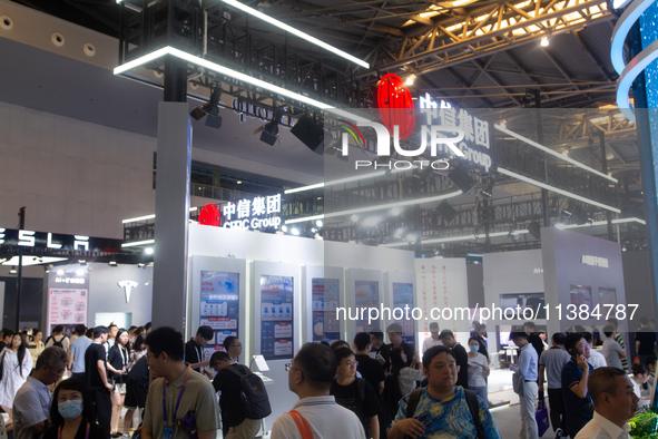 Visitors are visiting the CITIC Group stand at the World Artificial Intelligence Conference at the Shanghai World Expo Exhibition Center in...