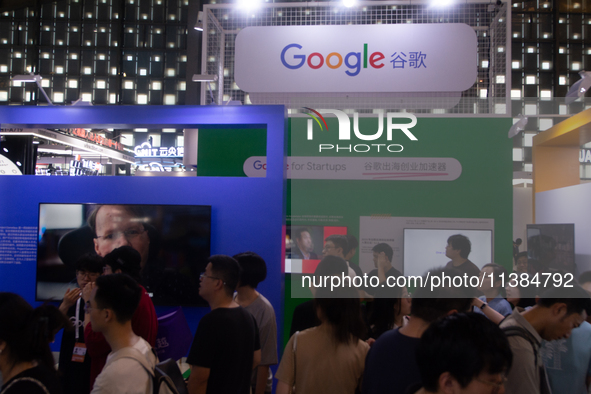 Visitors are visiting the Google stand at the World Artificial Intelligence Conference at the Shanghai World Expo Exhibition Center in Shang...