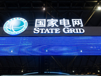 The logo of China State Grid is being seen at the World Artificial Intelligence Conference at the Shanghai World Expo Exhibition Center in S...