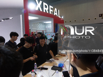 Visitors are visiting the Xreal stand at the World Artificial Intelligence Conference at the Shanghai World Expo Exhibition Center in Shangh...