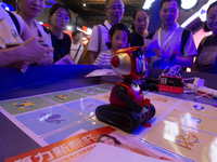 A small robot is being used for children learning at the World Artificial Intelligence Conference at the Shanghai World Expo Exhibition Cent...