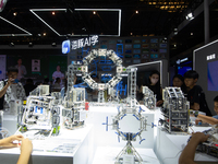 Children are playing at Hai Tun Zixi, a learning assistant AI, standing at the World Artificial Intelligence Conference at the Shanghai Worl...