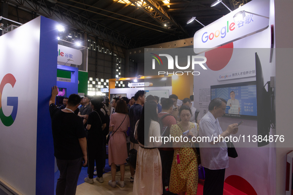 Visitors are visiting the Google stand at the World Artificial Intelligence Conference at the Shanghai World Expo Exhibition Center in Shang...