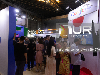 Visitors are visiting the Google stand at the World Artificial Intelligence Conference at the Shanghai World Expo Exhibition Center in Shang...