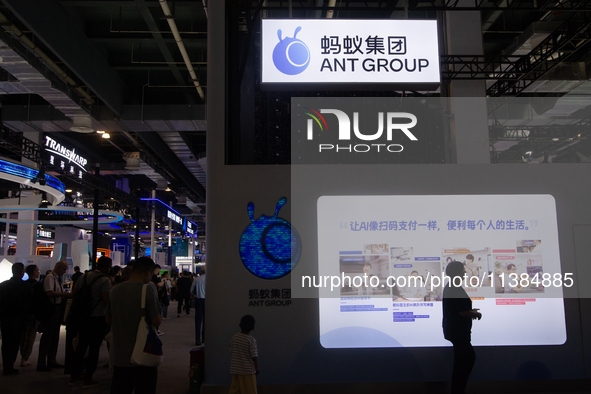 Visitors are visiting the Ant Group stand at the World Artificial Intelligence Conference at the Shanghai World Expo Exhibition Center in Sh...