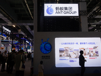 Visitors are visiting the Ant Group stand at the World Artificial Intelligence Conference at the Shanghai World Expo Exhibition Center in Sh...