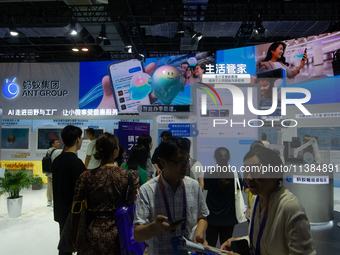 Visitors are visiting the Ant Group stand at the World Artificial Intelligence Conference at the Shanghai World Expo Exhibition Center in Sh...