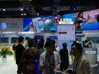 Visitors are visiting the Ant Group stand at the World Artificial Intelligence Conference at the Shanghai World Expo Exhibition Center in Sh...