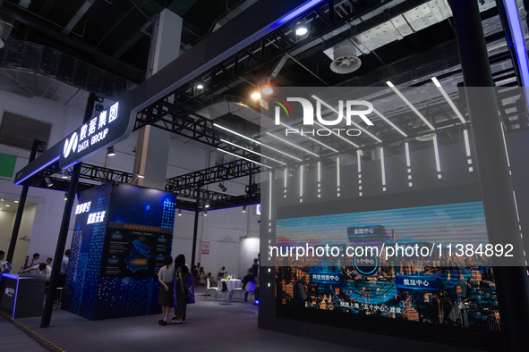 Visitors are visiting the Data Group stand at the World Artificial Intelligence Conference at the Shanghai World Expo Exhibition Center in S...