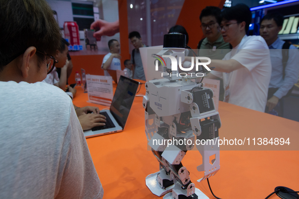 Visitors are visiting the Rock AI stand at the World Artificial Intelligence Conference at the Shanghai World Expo Exhibition Center in Shan...